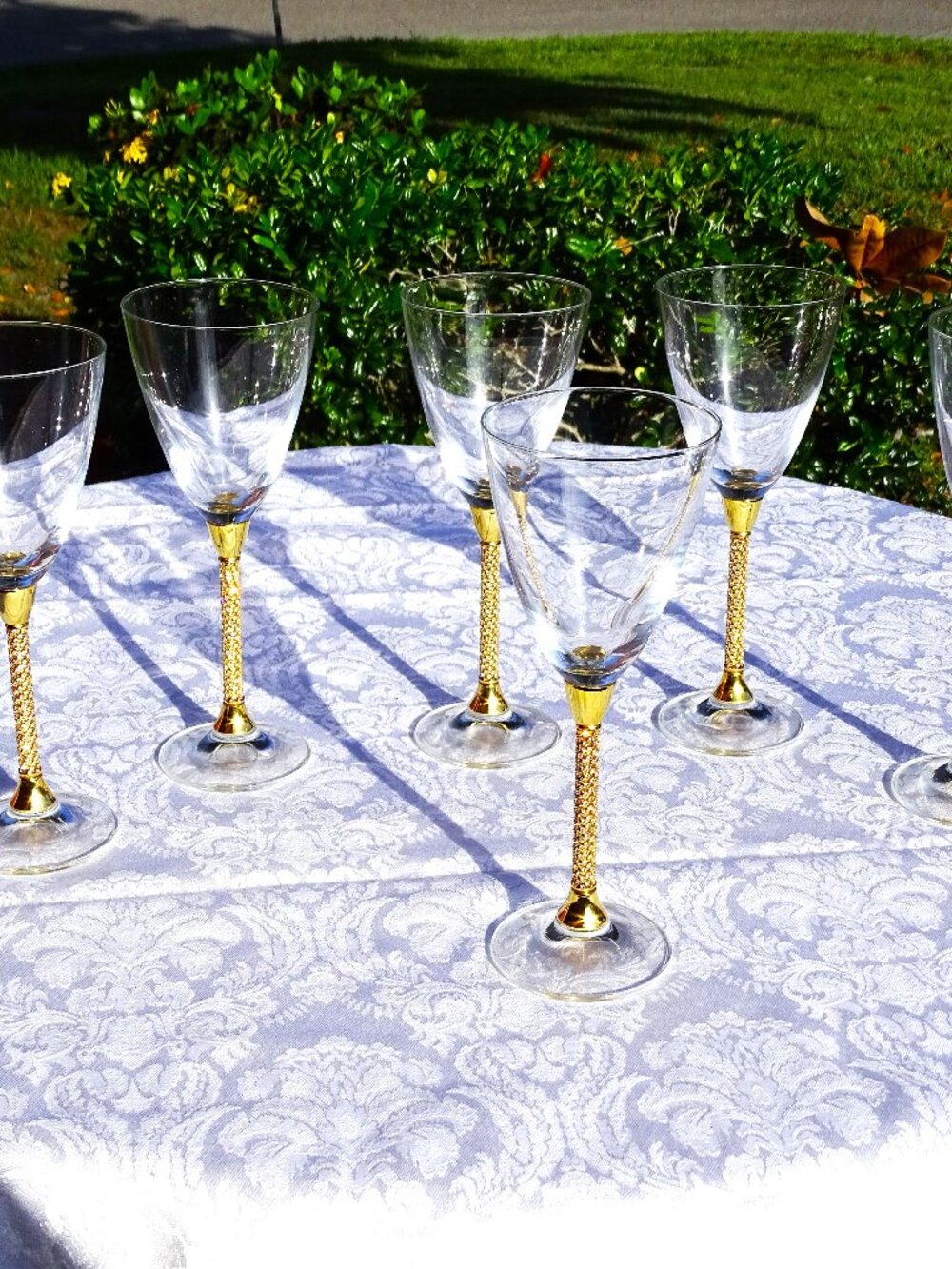 Six Crystal Wine Glasses with Gold Metal and Crystal Stems.